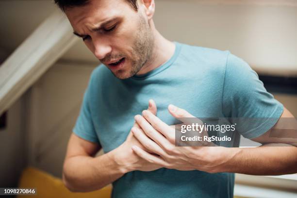 ill man holding his chest - heart attack stock pictures, royalty-free photos & images