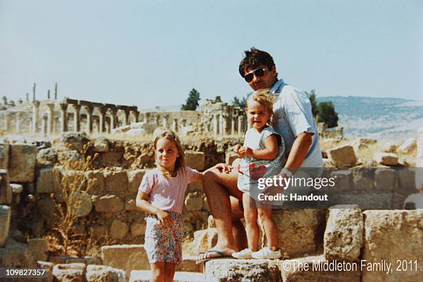 In this Handout Image provided by Clarence House www.officialroyalwedding2011.org, Kate Middleton with sister Pippa and Father Michael in Jerash,...