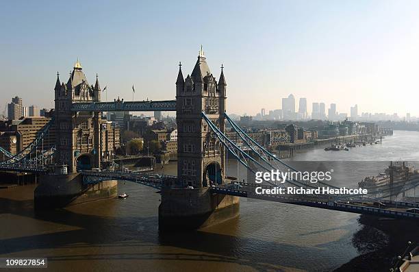 Tower Bridge with Canary Wharf in the distance viewed from the top of City Hall on March 7, 2011 in London, England.