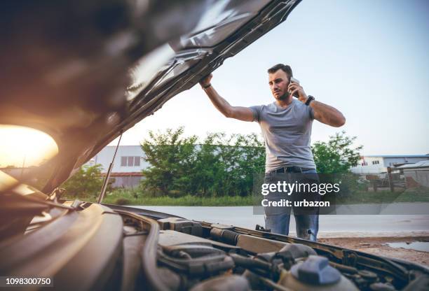 calling roadside assistance - road assistance stock pictures, royalty-free photos & images