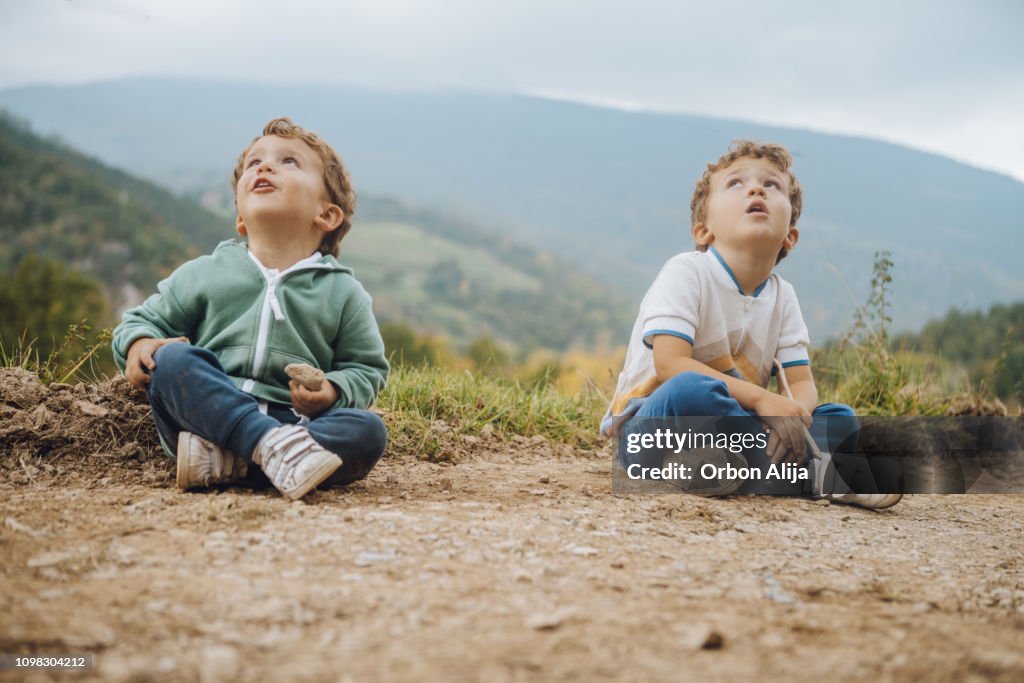 Brothers playing outdoors