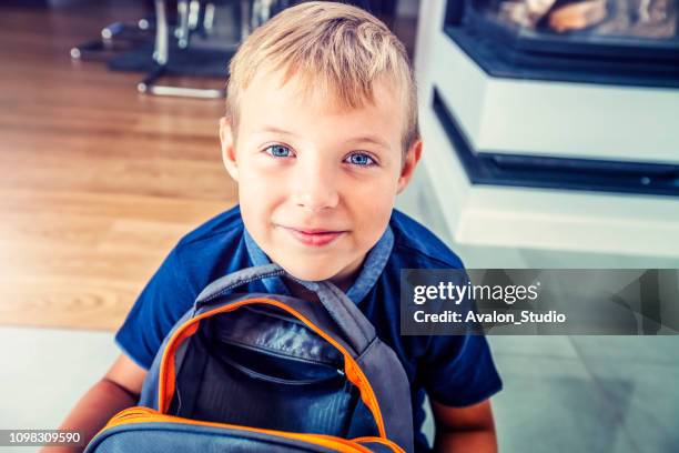 schoolboy with a school backpack - open rucksack stock pictures, royalty-free photos & images