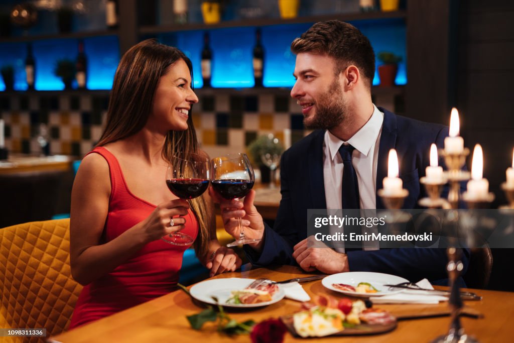 Couple enjoying red wine on Valentine's Day