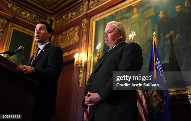 Wisconsin Gov. Scott Walker speaks during a press conference as republican State senator Scott Fitzgerald looks on March 7, 2011 in Madison,...