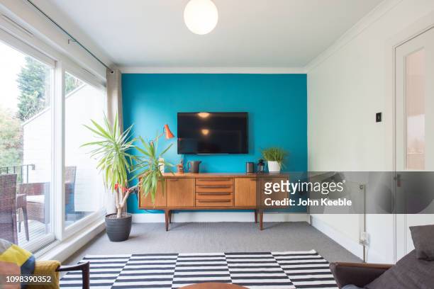 property interiors - tv in living room stock pictures, royalty-free photos & images