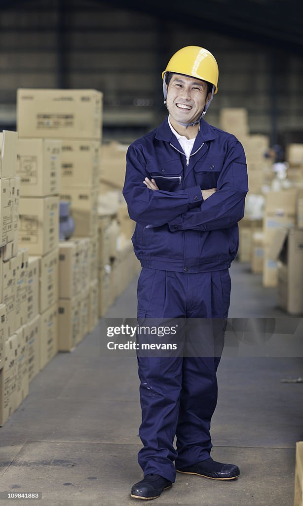 Japanese Worker in Warehouse