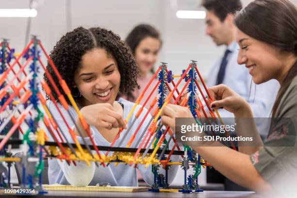 high school students build bridge replica in engineering class - bridge built structure stock pictures, royalty-free photos & images