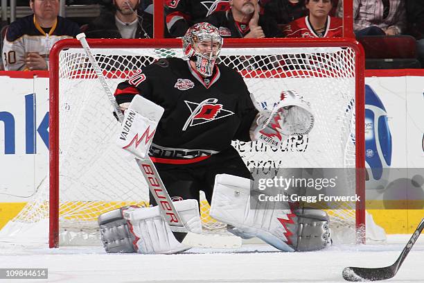 Cam Ward of the Carolina Hurricanes goes down in the crease to protect the net during an NHL game against the Buffalo Sabres on March 3, 2011 at RBC...