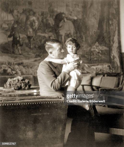 Adolf Hitler and Uschi Schneider, the daughter of Herta Schneider, a close childhood friend of Eva Braun, at the Berghof, Berchtesgaden, Germany,...