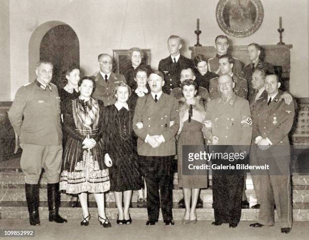 Adolf Hitler with guests at at his residence, the Berghof near Berchtesgaden, Germany, 31st December 1939. Front row left to right: Wilhelm Bruckner...
