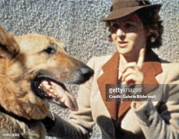 Eva Braun and Blondi, Adolf Hitler's German shepherd, at the Berghof, Hitler's residence near Berchtesgaden, Germany, 1942. Eva Braun had a dislike...