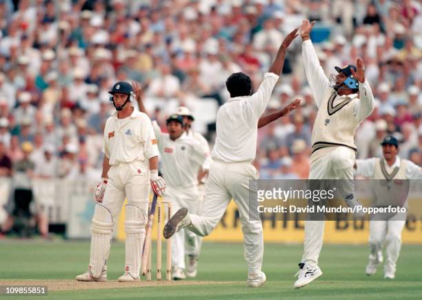 England batsman Nasser Hussain's innings of 128 comes to an end, caught by Rahul Dravid off the bowling of Javagal Srinath during the 1st Test match...