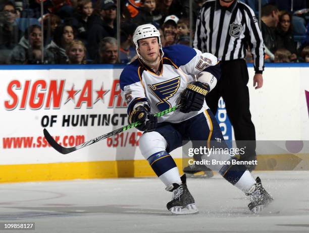 Cam Janssen of the St. Louis Blues skates against the New York Islanders at the Nassau Coliseum on March 5, 2011 in Uniondale, New York.