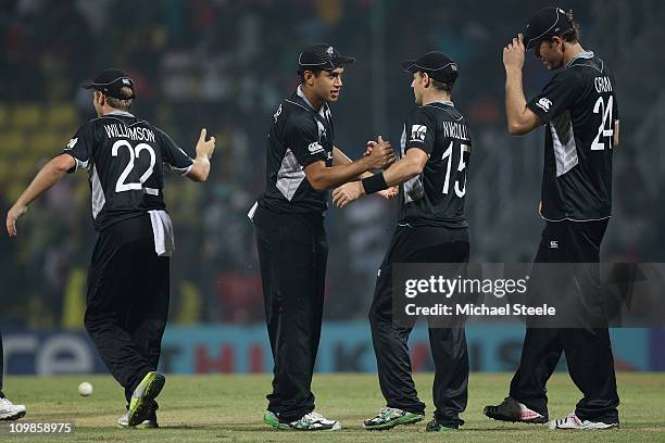 Ross Taylor stand in captain of New Zealand congratulates his players including Nathan McCullum after his sides victory during the New Zealand v...