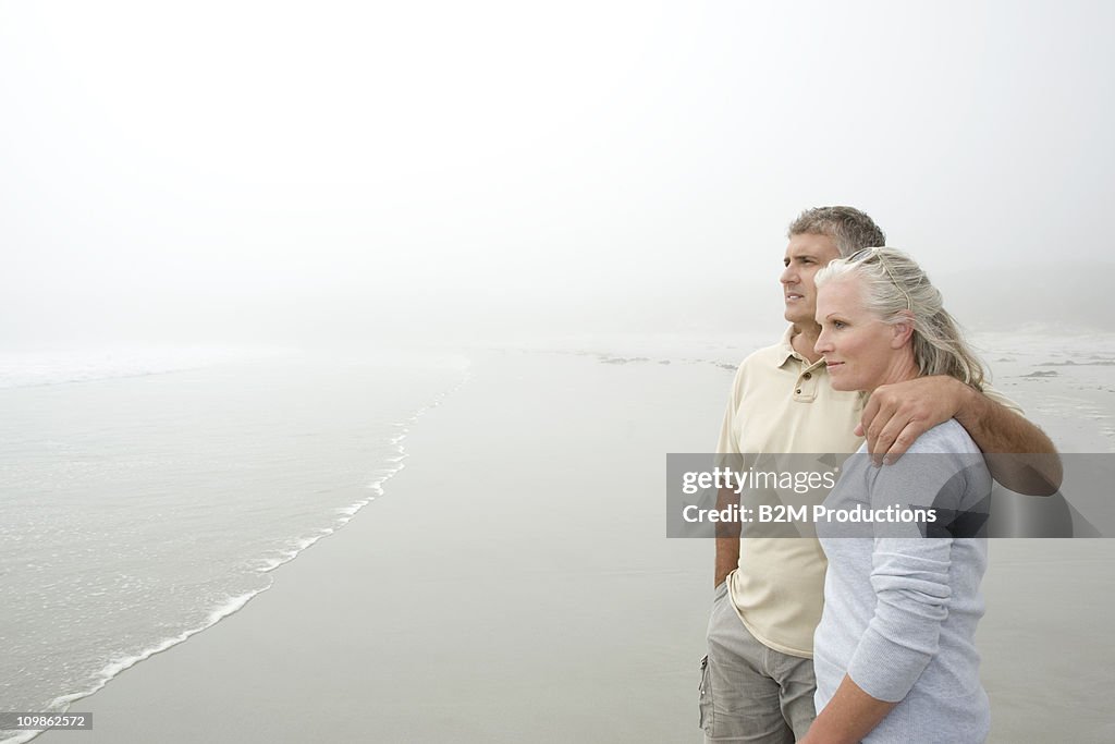 Mature couple at the beach enjoying view