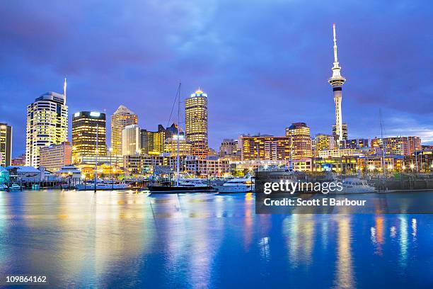 auckland skyline with sky tower. viaduct basin - auckland waterfront stock pictures, royalty-free photos & images