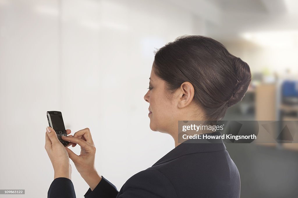 Female office worker texting