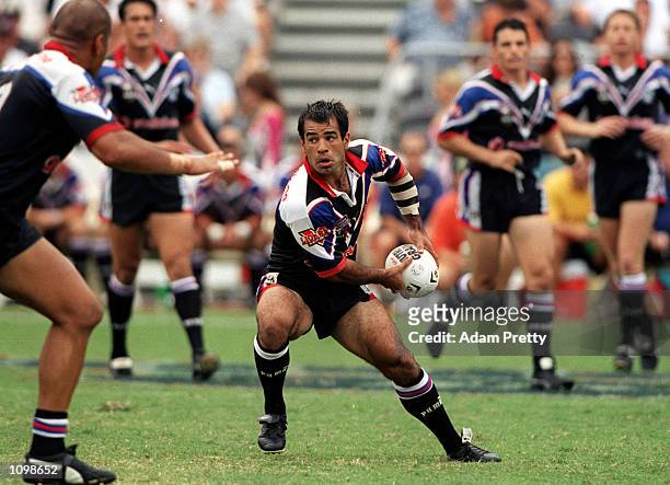 Stacey Jones of New Zealand looks to spread the ball during the NRL match between the New Zealand Warriors and the Northern Eagles at Northpower...