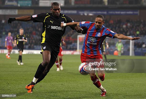 Jay Emmanuel-Thomas of Cardiff City tries to tackle Nathaniel Clyne of Crystal Palace during the npower Championship match between Crystal Palace and...