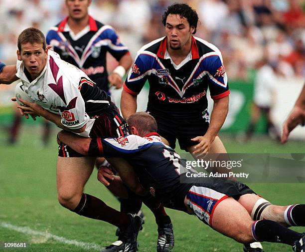 Greg Ebrill of the Northern Eagles looks to pass out of the tackle during the NRL match between the New Zealand Warriors and the Northern Eagles at...