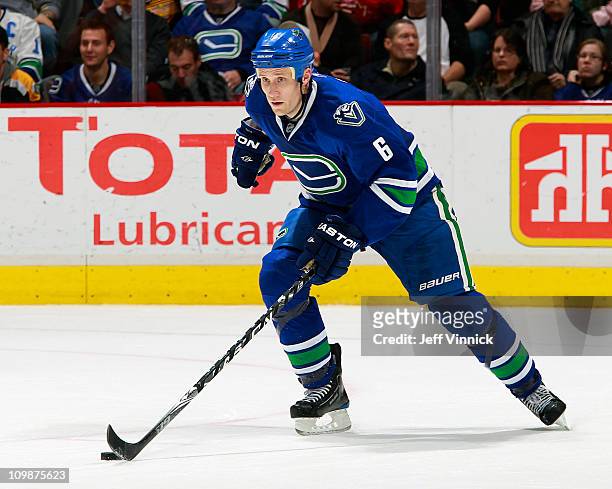 Sami Salo of the Vancouver Canucks skates up ice with the puck during their game against the Boston Bruins at Rogers Arena on February 26, 2011 in...