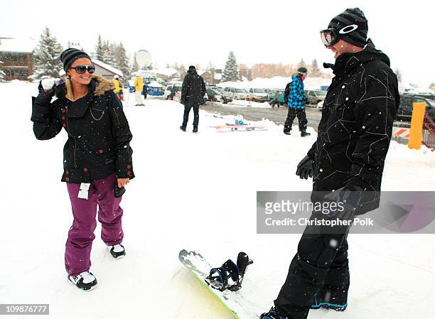 Paris Hilton and Doug Reinhardt attend Oakley Learn To Ride Snowboard fueled by Muscle Milk at Oakley Lodge on January 23, 2010 in Park City, Utah.