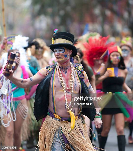 The Mondo Kayo Social and Marching Club make their way along the parade route on St. Charles Avenue during the Mardi Gras parade on Fat Tuesday in...