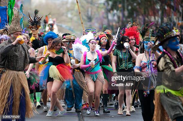 The Mondo Kayo Social and Marching Club make their way along the parade route on St. Charles Avenue during the Mardi Gras parade on Fat Tuesday in...