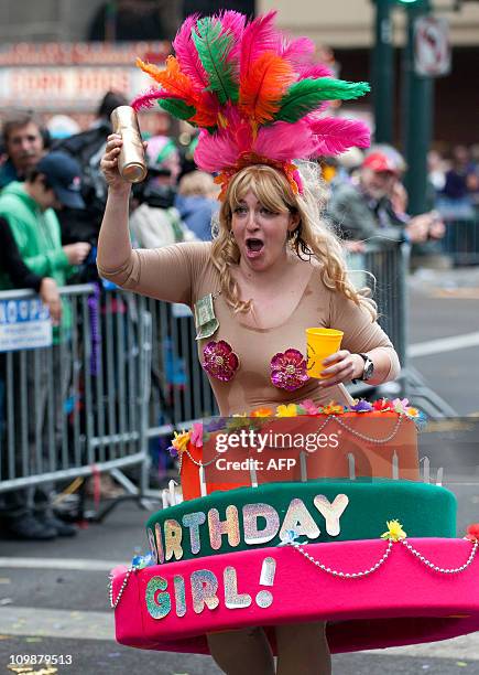 Member of the Mondo Kayo Social and Marching Club walks the parade route on St. Charles Avenue during the Mardi Gras parade on Fat Tuesday in New...