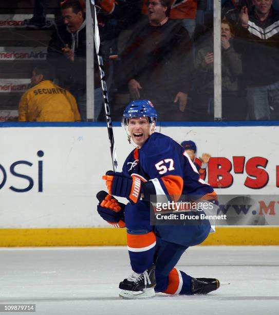 Blake Comeau of the New York Islanders scores the winning goal at 4:02 of overtime to defeat the Toronto Maple Leafs 4-3 at the Nassau Coliseum on...