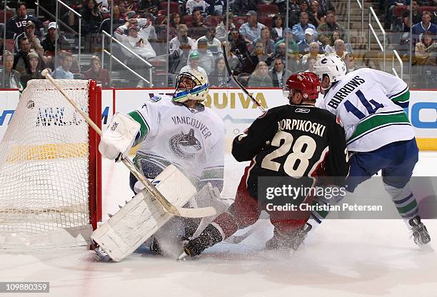 Lauri Korpikoski of the Phoenix Coyotes scores a second period goal past goaltender Roberto Luongo of the Vancouver Canucks during the NHL game at...