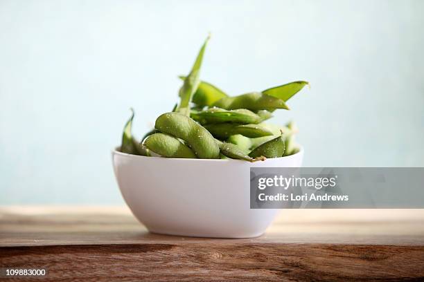 edamame in a white dish - edamame stock pictures, royalty-free photos & images