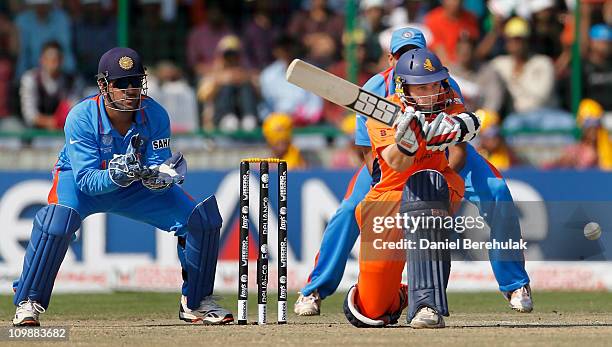 Dhoni of India keeps wicket while Wesley Barresi of the Netherlands bats during the 2011 ICC Cricket World Cup Group B match between India and the...