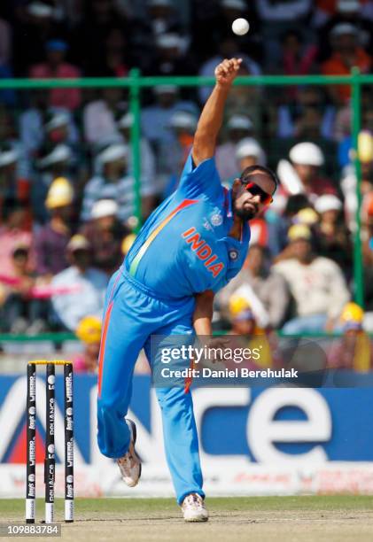 Yusuf Pathan of India bowls during the 2011 ICC Cricket World Cup Group B match between India and the Netherlands at Feroz Shah Kotla stadium on...