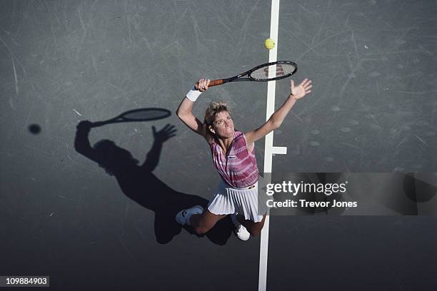 Chris Evert- Lloyd of the United States serves to Claudia Kohde-Kilsch during their Women's Singles Quarter-Final match of the US Open Tennis...