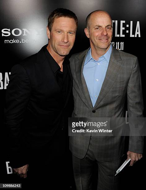 Actor Aaron Eckhart and producer Neal H. Moritz arrive at the premiere of Columbia Pictures' "Battle: Los Angeles" at the Village Theater on March 8,...