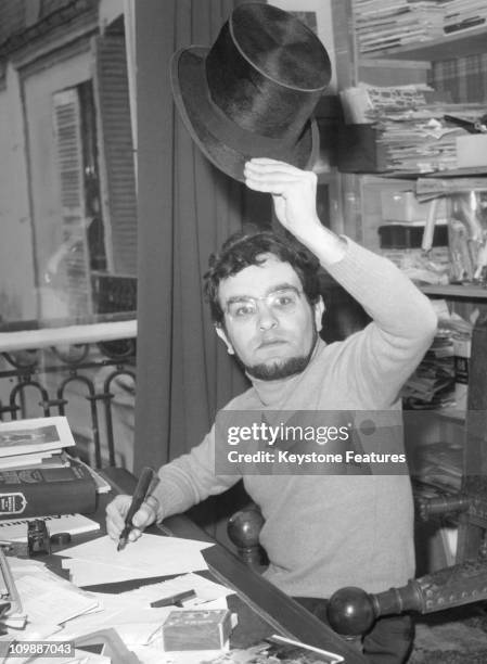 Spanish author and playwright Fernando Arrabal in his Paris apartment, 1967.