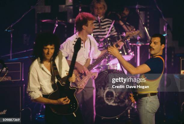 British rock group Queen performing on stage, 1986. Left to right: Brian May, John Deacon, Roger Taylor and Freddie Mercury .