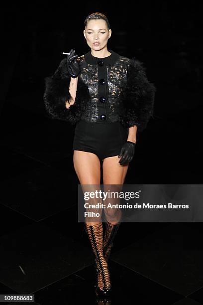 Kate Moss walks the runway during the Louis Vuitton Ready to Wear Autumn/Winter 2011/2012 show during Paris Fashion Week at Cour Carree du Louvre on...