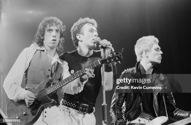 English punk group The Clash performing at the Apollo, Manchester, 2nd July 1978. Left to right: Mick Jones, Joe Strummer and Paul Simonon.