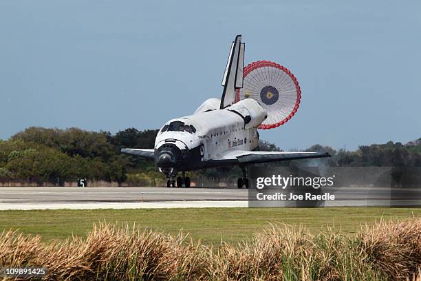 The space shuttle Discovery lands at Kennedy Space Center after returning for the last time from a space flight to the International Space Station on...