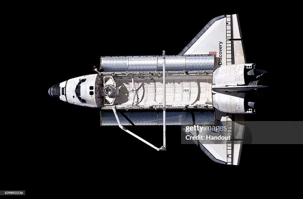 Space Shuttle Discovery Continues On Its Last Mission