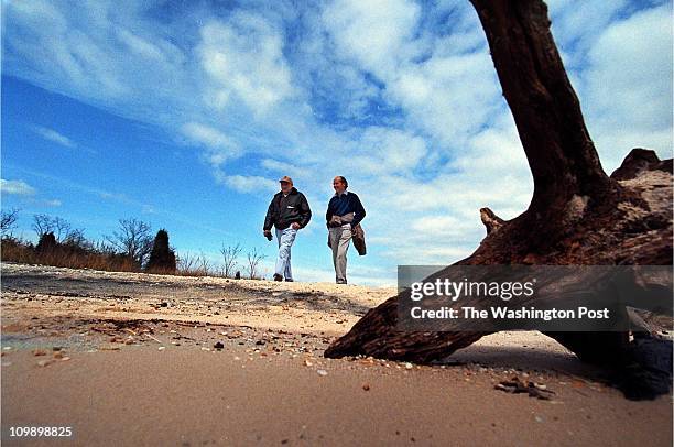 Jack Witten and Erik Jansson both with the Potomac River Association walk on the beach area of Myrtle Point in St. Mary's County Friday afternoon...