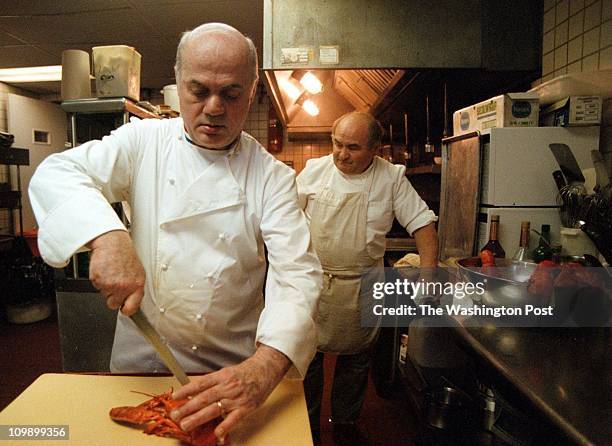 By Dayna Smith TWP. Chef Peirre Chauvet in the kitchen of his restaurant, La Fourchette in Adams Morgan cutting a lobster.