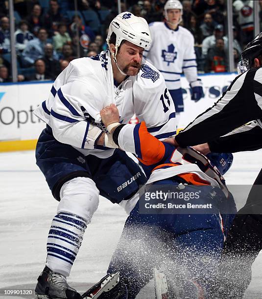 Mike Brown of the Toronto Maple Leafs fights with Michael Haley of the New York Islanders at the Nassau Coliseum on March 8, 2011 in Uniondale, New...