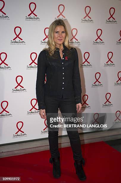 French TV host Stephanie Renouvin poses while arriving on March 9, 2011 in Paris to attend the start of the 17th edition of the French Sidaction, an...
