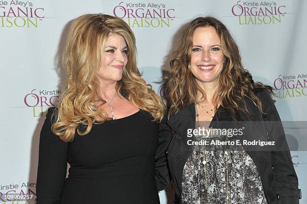 Actress Kirstie Alley and actress Kelly Preston arrive to the opening of Kirstie Alley's Organic Liaison Store on March 9, 2011 in Los Angeles,...