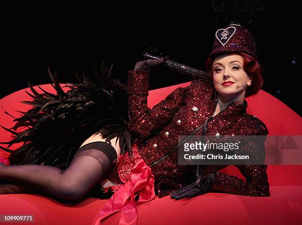 Polly Rae performs during a photocall for her new stage show, The Hurly Burly show, which is directed by William Baker at the Garrick Theatre on...