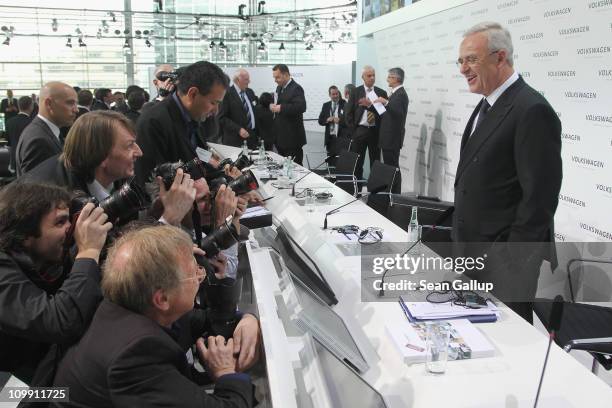 Martin Winterkorn , Chairman of German carmaker Volkswagen AG,pauses for photographers before departing following the company's annual press...