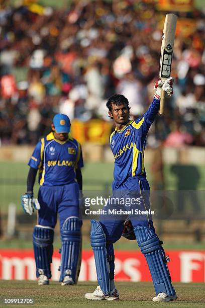 Upul Tharanga of Sri Lanka celebrates reaching his century during the Sri Lanka v Zimbabwe 2011 ICC World Cup Group A match at the Pallekele Cricket...